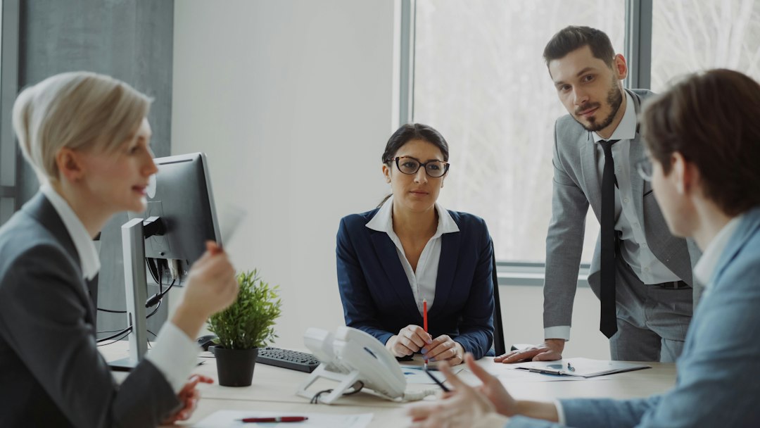 Professionals discussing presentation goals in a modern office